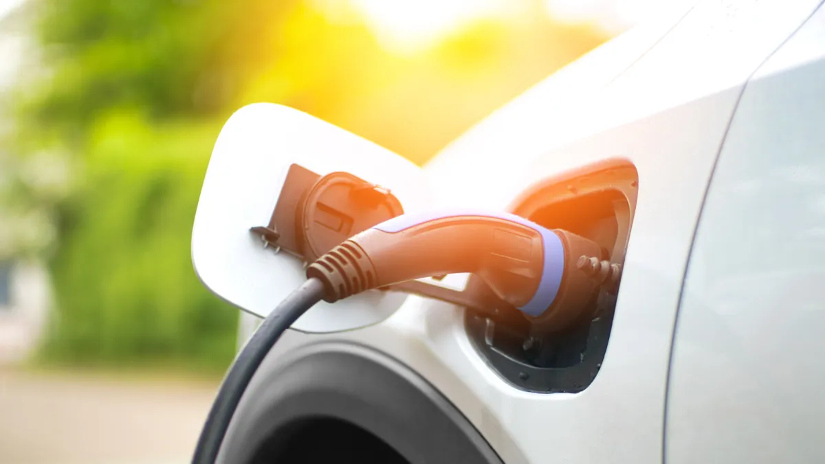 Electric car charging at power station