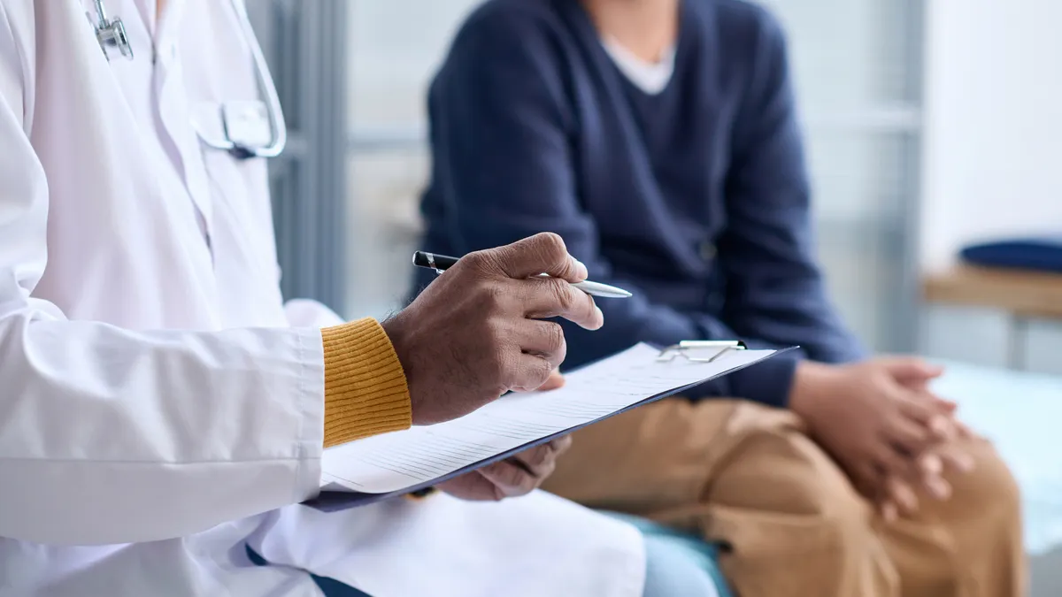 Doctor Holding Clipboard