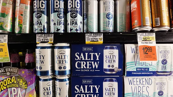 Beers are displayed for sale in a supermarket