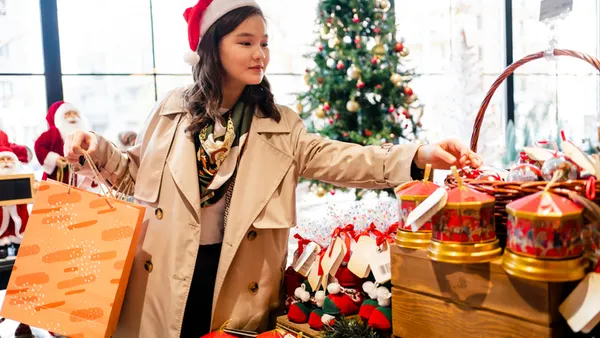 Person doing shopping at Christmas market.