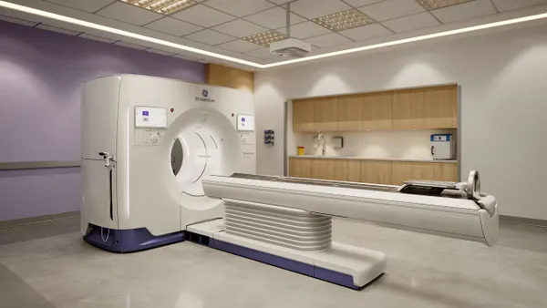 GE HealthCare's Photonova Spectra photon-counting CT system is shown in a room.