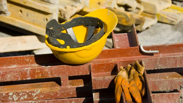 An empty hard hat on a construction site.