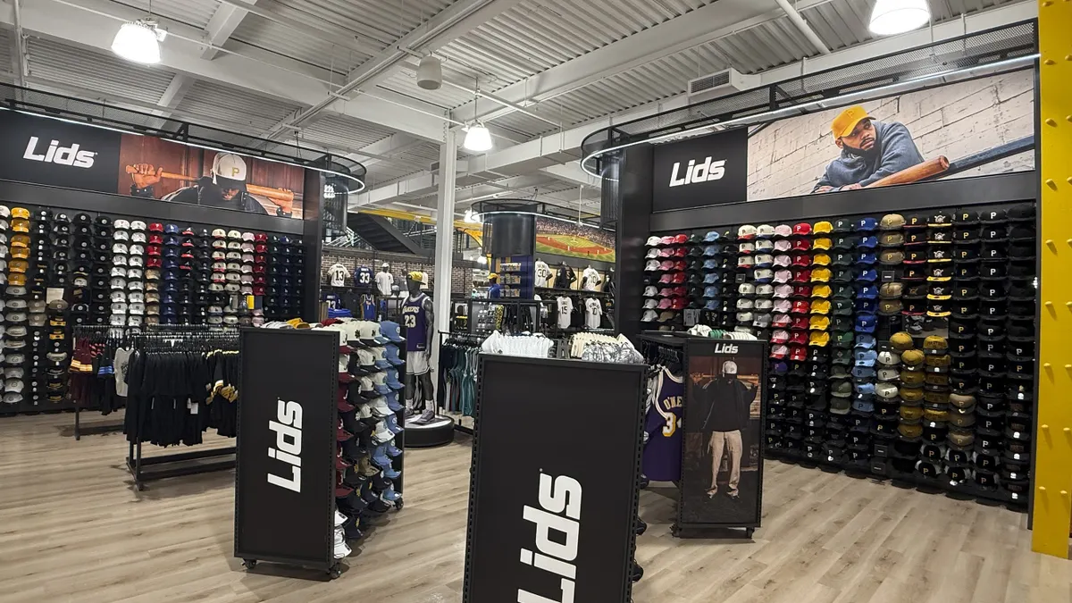 A display of Lids hats in a Dick's Sporting Goods store.