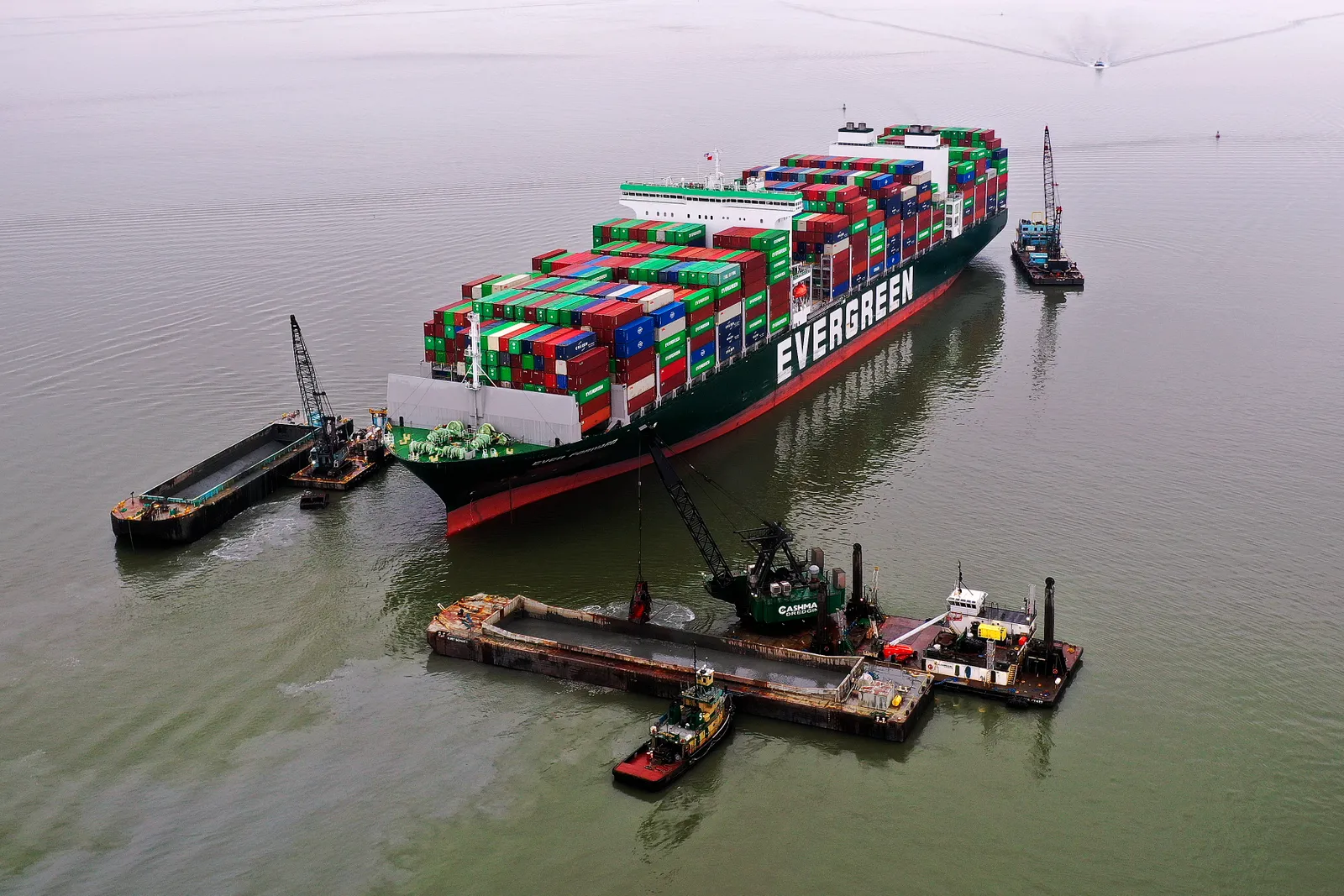 Crews remove containers from the Evergreen Ever Forward after it ran aground in the Chesapeake Bay.