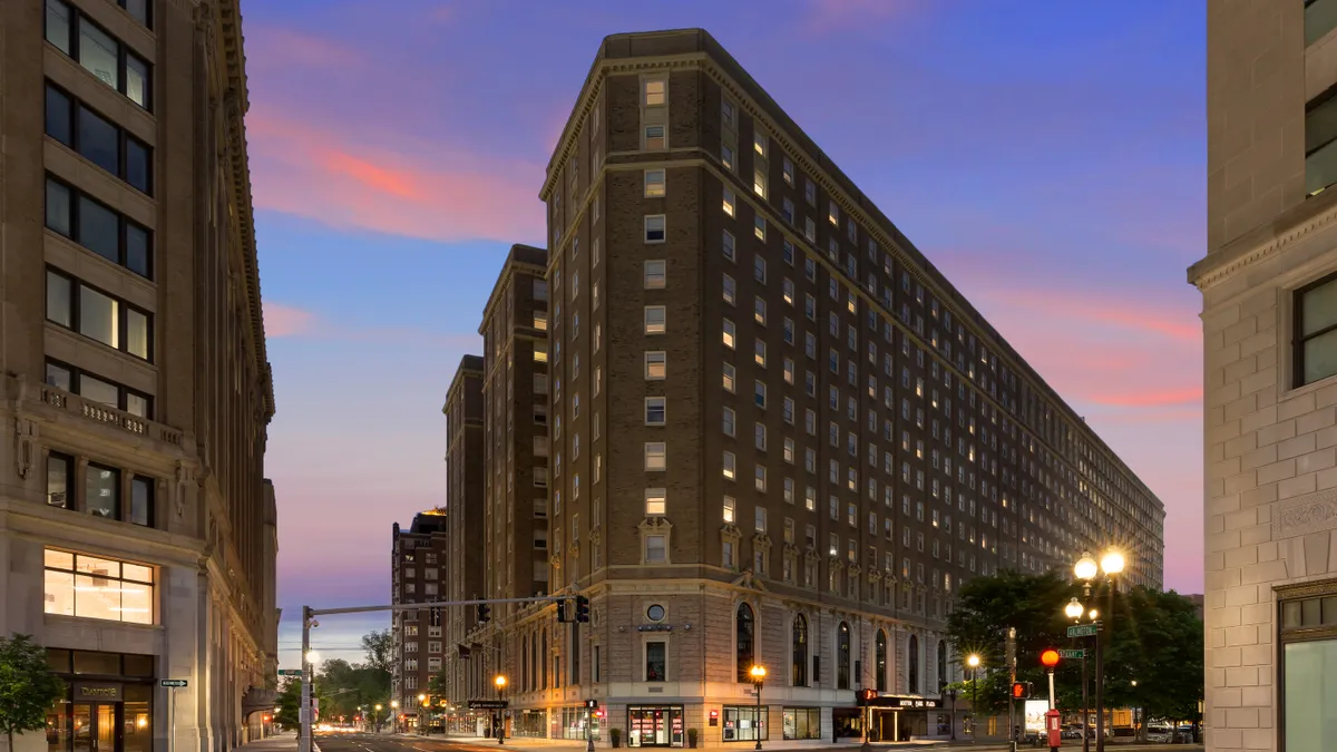 The exterior of the Hilton Boston Plaza at twilight.