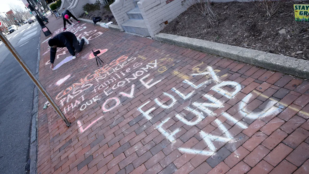 Sidewalk chalk art implores Congress to "fully fund WIC"