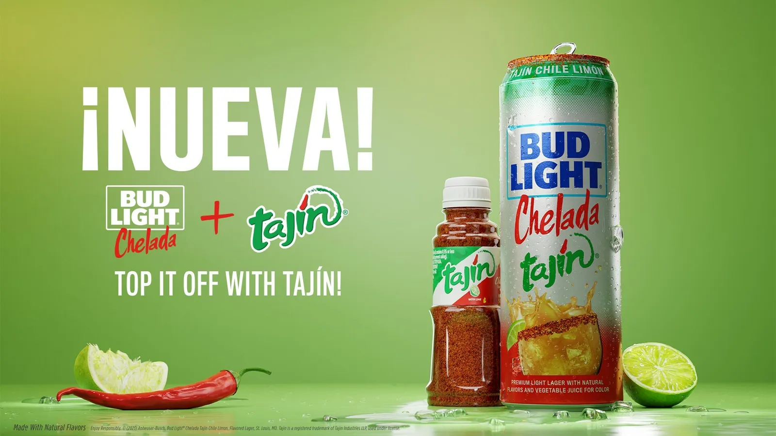 A photo of a can of Bud Light Chelada Tajin next to a bottle of tajin on a green table with a chili pepper and some limes around them.