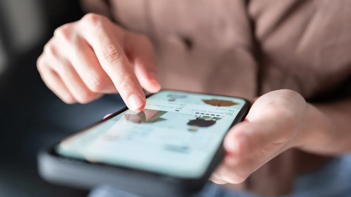 Woman shopping online with a smart phone