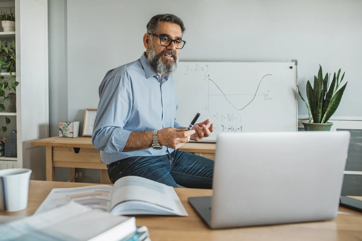 Professor teaching students remotely