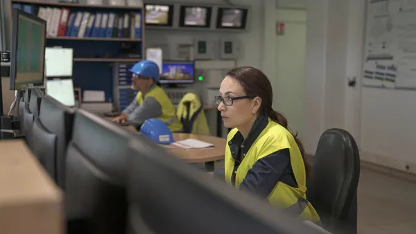 Industrial technician working in monitoring control room