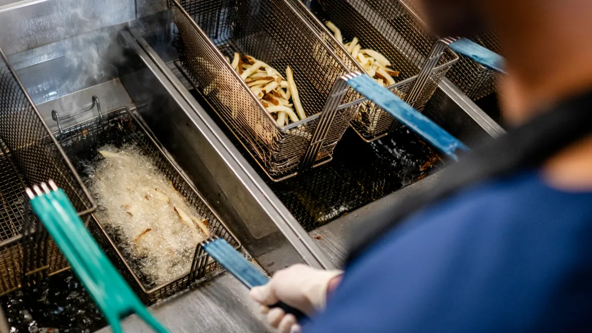 Frying french fries in a restaurant