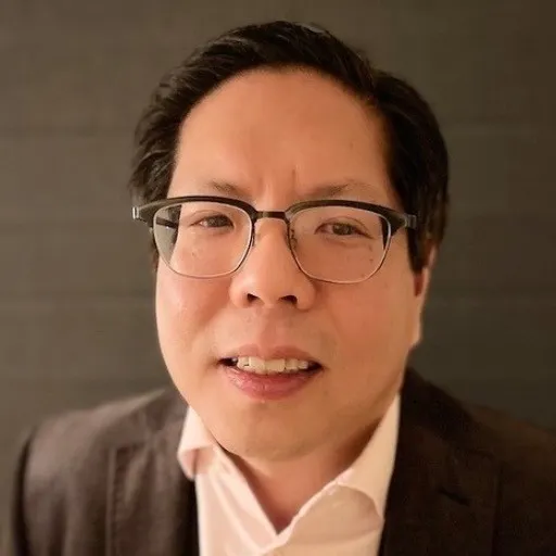 A professional headshot.