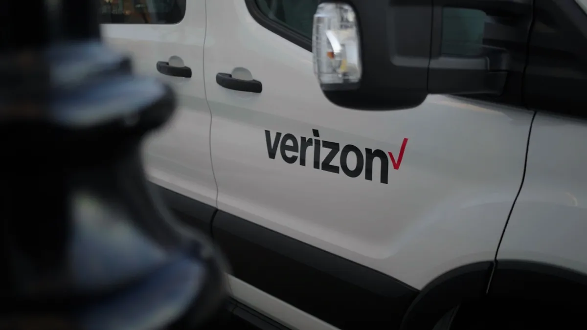 A view of an electric vehicle carrying the Verizon logo