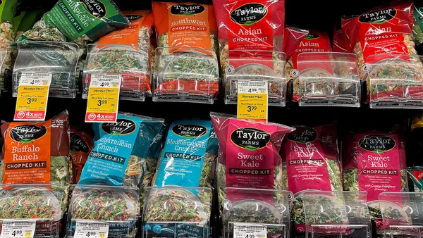 Packages of Taylor Farms salad greens are displayed