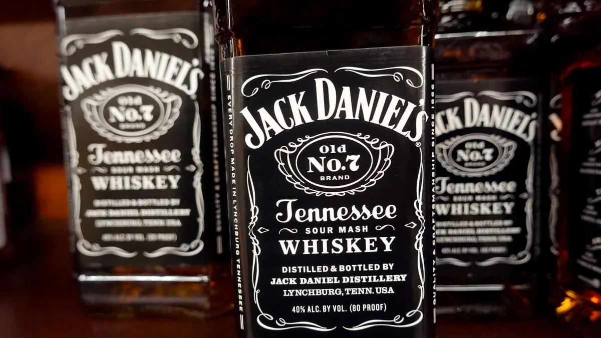A close up of the labels on Jack Daniel's bottles.
