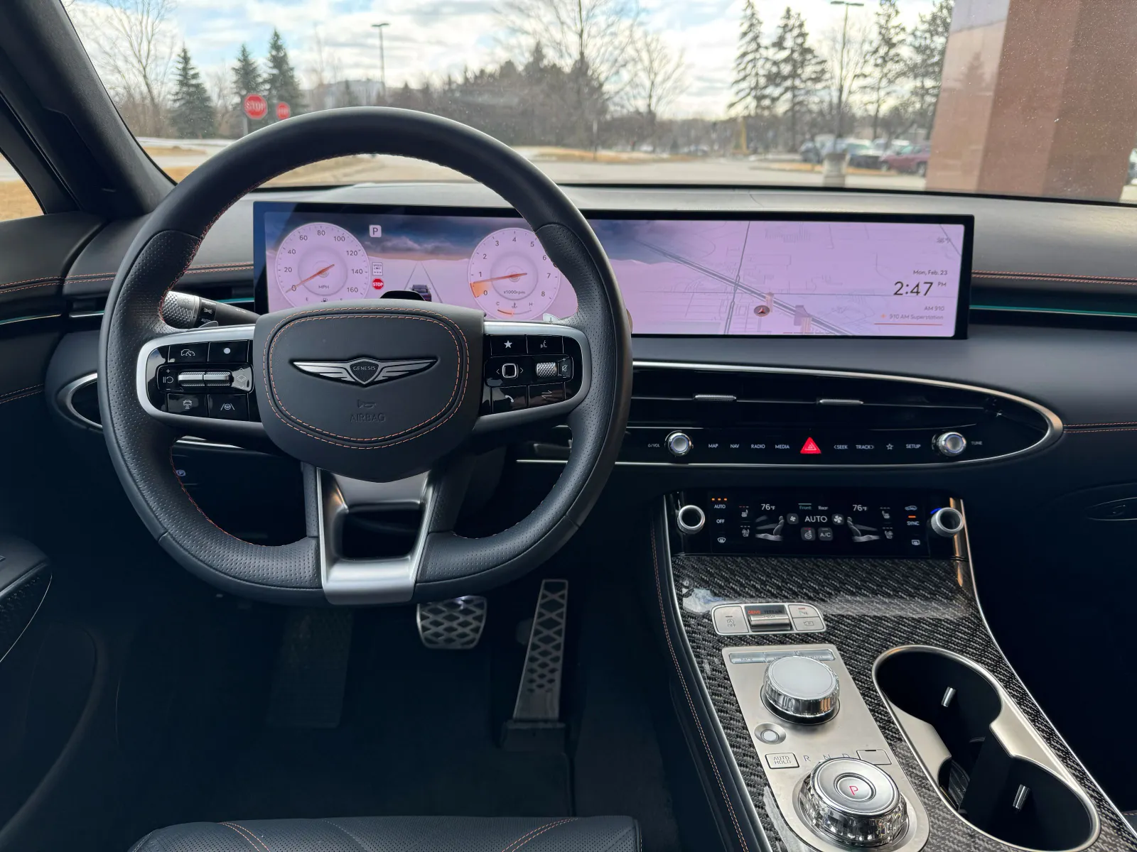 The Genesis GV70 Sport Prestige extensively uses aluminum, leather, and carbon fiber — all authentic — in the cabin. The 27-inch OLED screen combines the gauge cluster and infotainment while providing an open view in the interior.