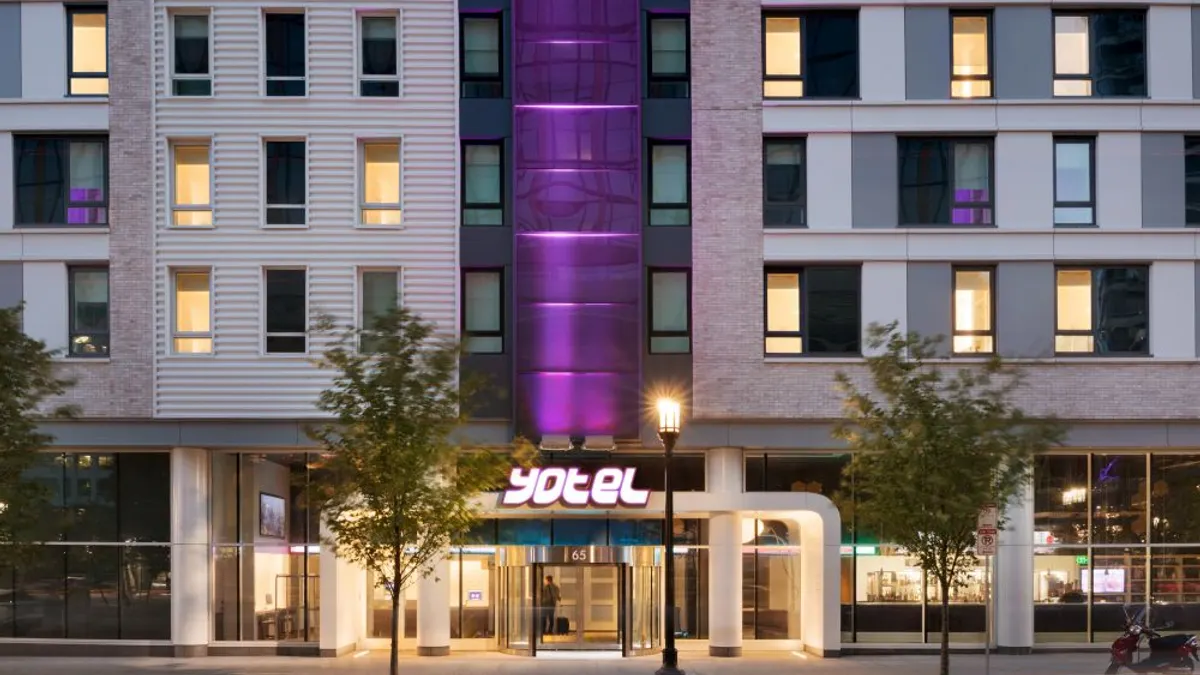 The exterior and logo of a Yotel hotel.
