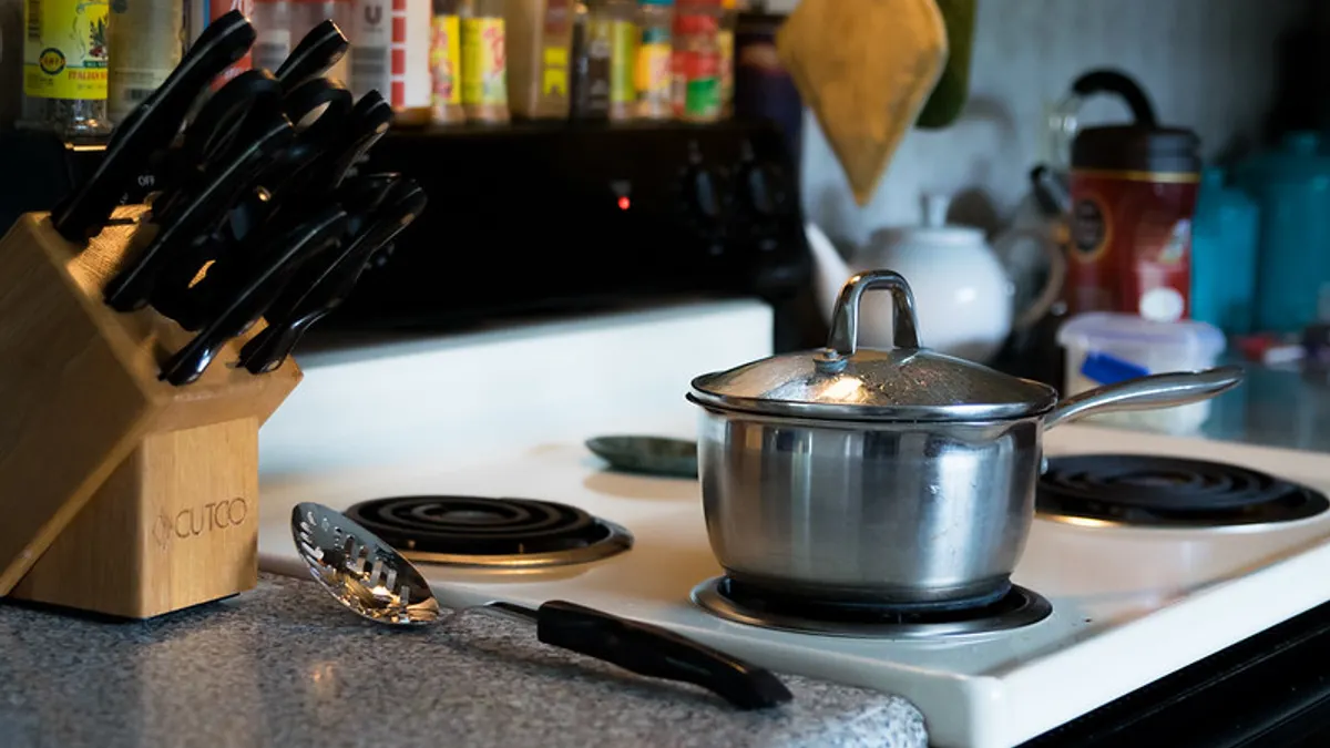 A pot on a stove in a home kitchen