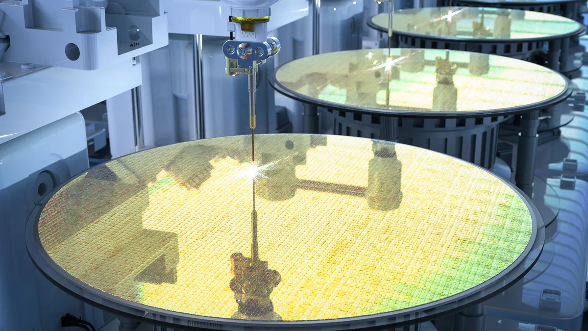 3D rendering robotic arms on a gold silicon wafer.