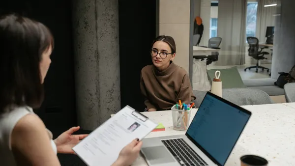 Photo of a young woman having a job interview.