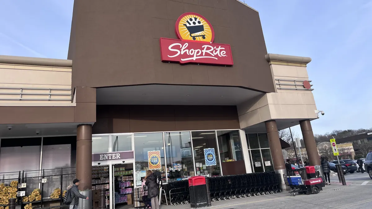 Exterior of a supermarket with a sign that says "ShopRite" above the entrance.
