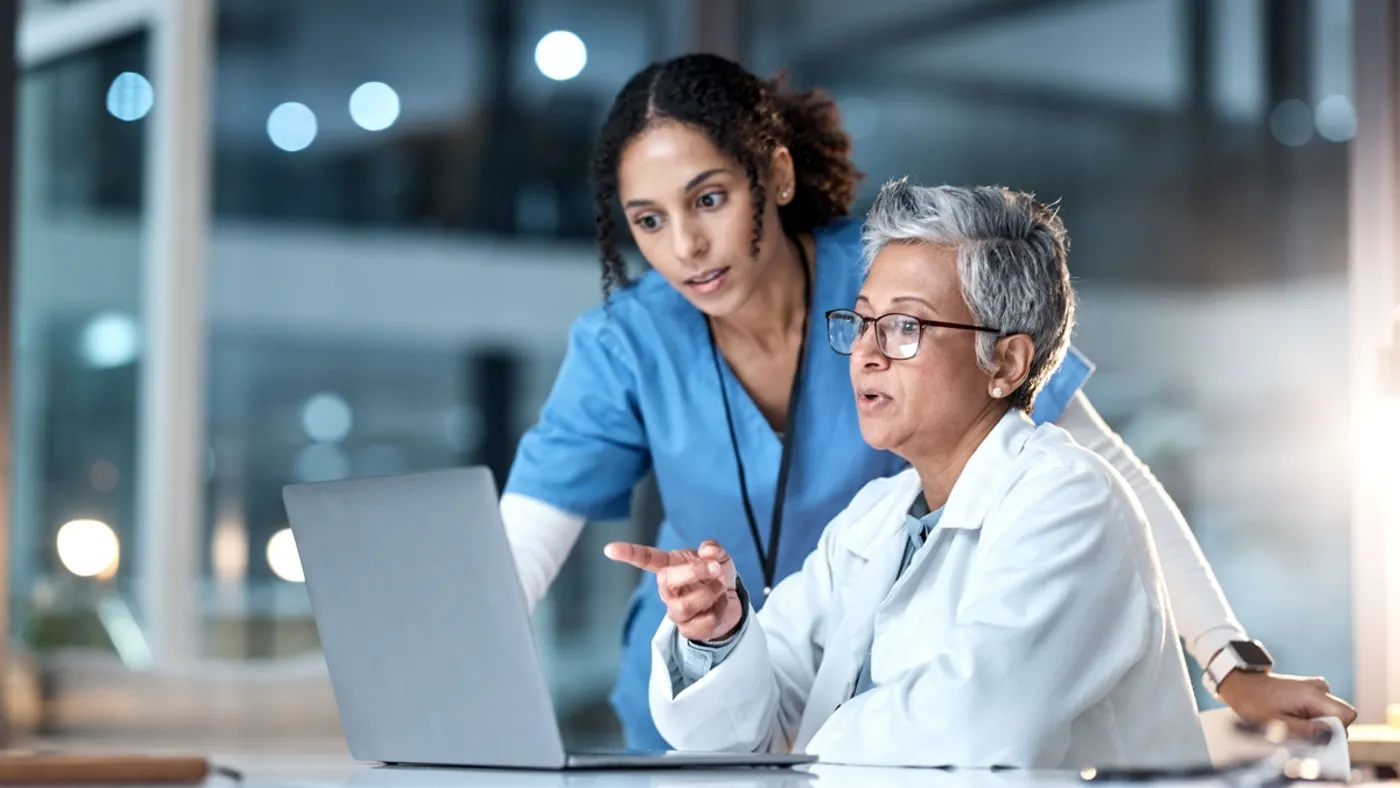 Doctor and nurse looking at computer