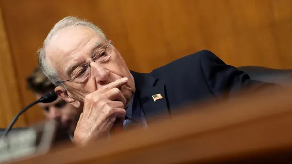 Senator Chuck Grassley is seen in a close-up at a committee hearing.