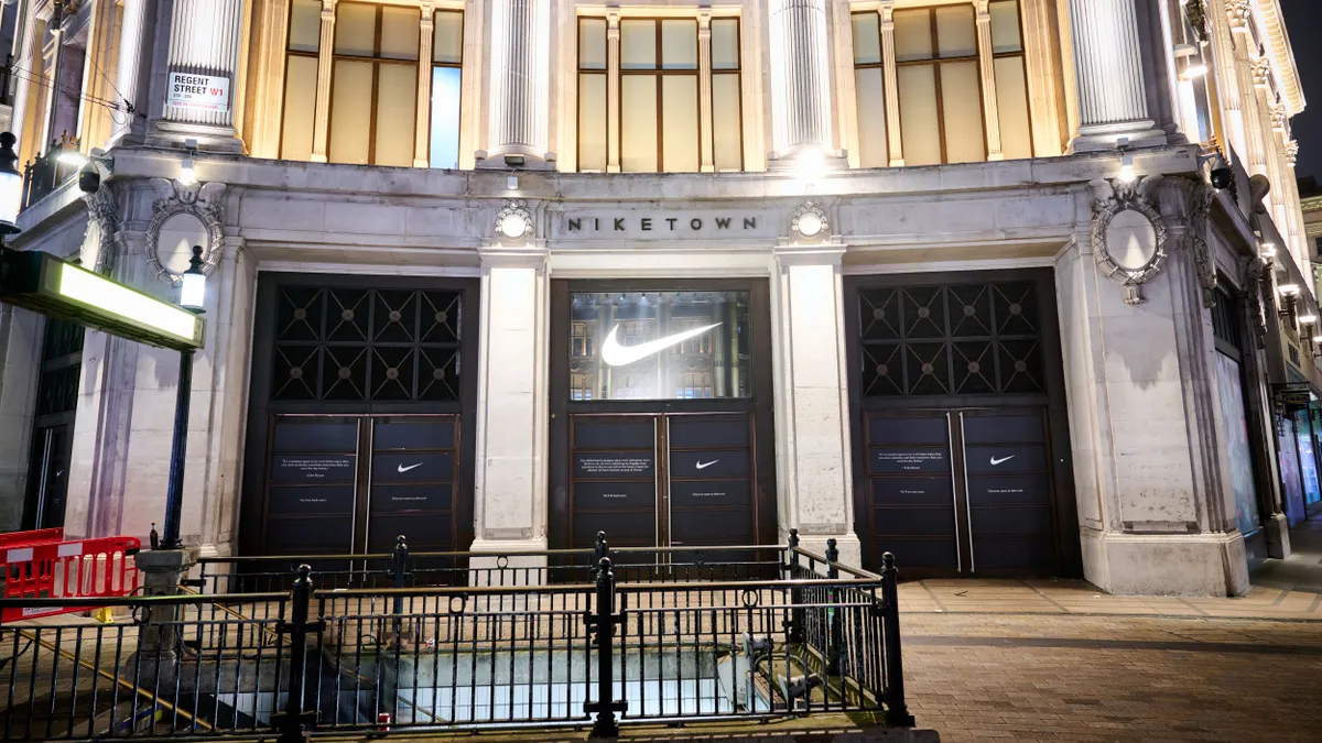 A Nike storefront at night in London.