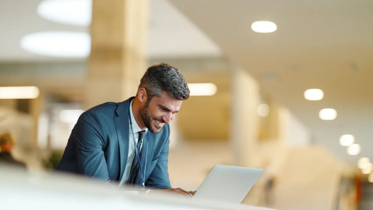 A Business person is using a laptop