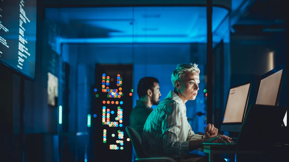 Caucasian female IT engineer working in server room