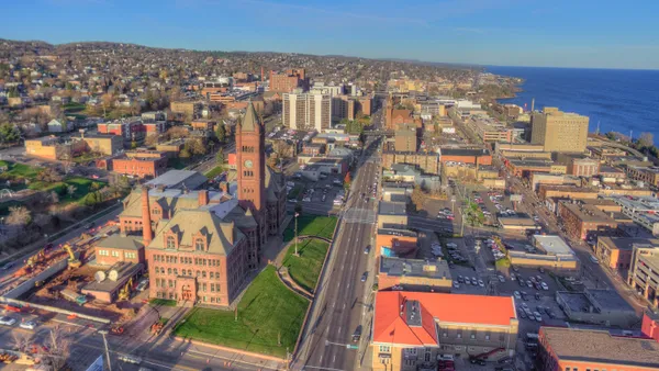 Aerial shot of roads running through a dense urban area on the waterfront