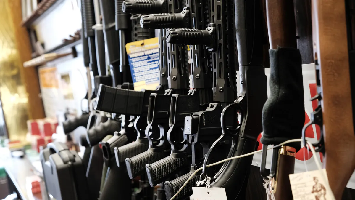 Guns are shown in a gun store