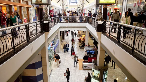 Shoppers walk through a mall during the holiday season.