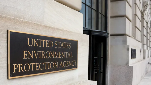 The EPA headquarters building, showing a sign and revolving entryway.