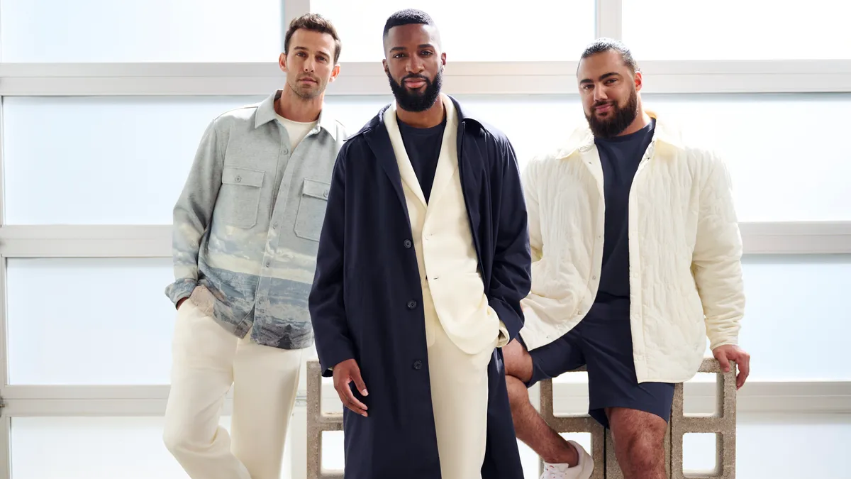 A group of people wearing clothes from J.C. Penney's Stylus menswear brand.