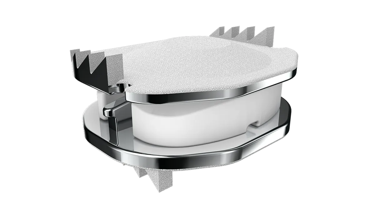 A device with two metal plates and a white material in between.