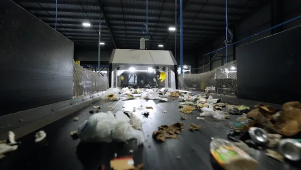 A close up image of recycled material moving along a belt