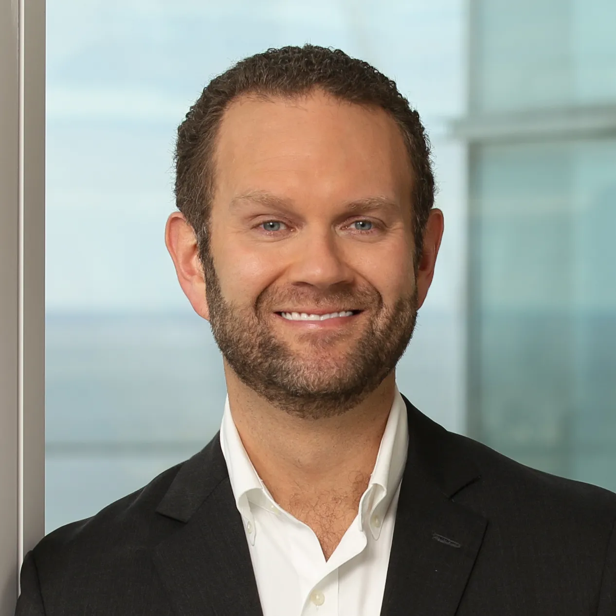 a headshot of executive Christian Mitchell in business attire.