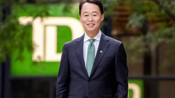 Raymond Chun, TD executive, poses for a photo wearing a suit and tie