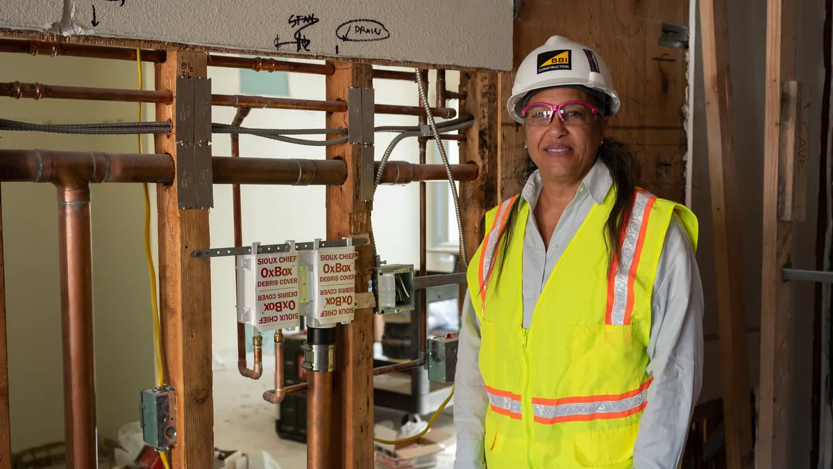 Woman in construction gear on site