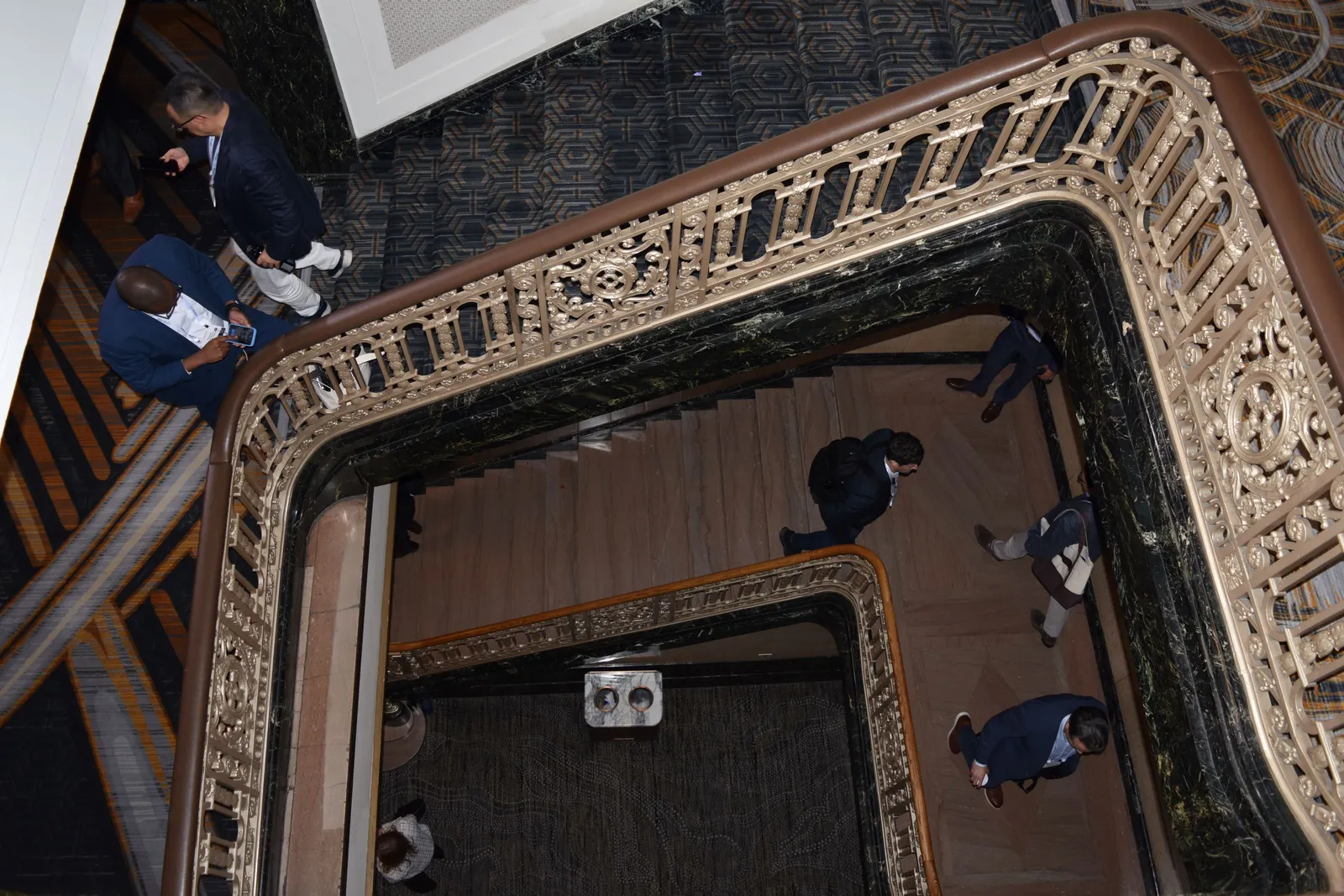 A photo of people walking on staircases at the Westin St. Francis Hotel in San Francisco