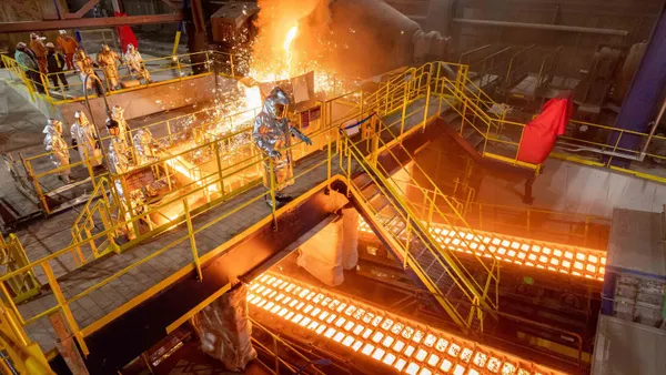 Employees working at the U. S. Steel Gary Works pig iron caster.