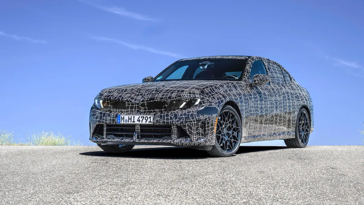 The 2027 BMW 3-Series, in camouflaged prototype form.