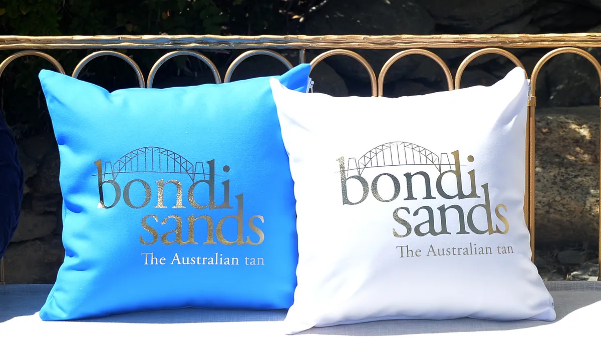 A white and blue set of pillows saying Bondi Sands