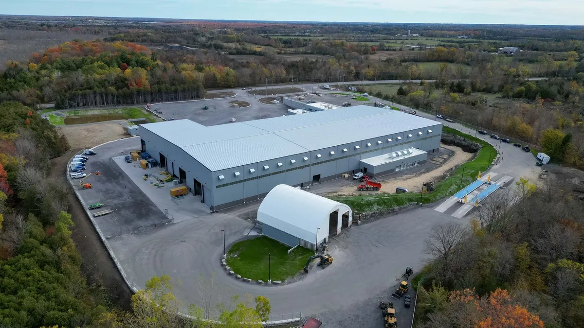 An aerial photo of a recycling facility surrounded by plains and trees.