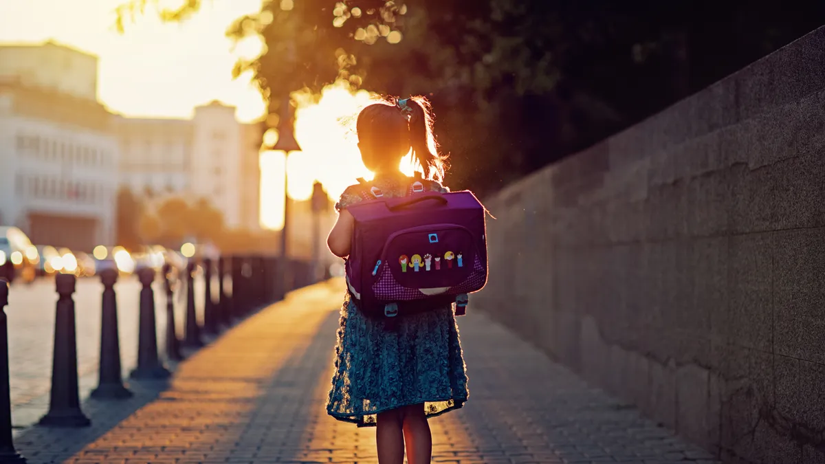 Schoolgirl is returning from school