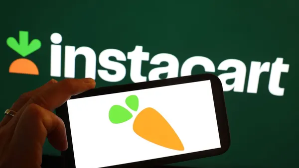 The Instacart logo is displayed on a computer monitor.