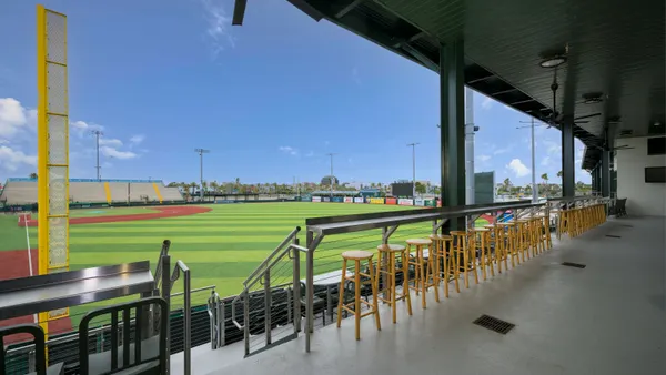 A view of a small ballpark from the concourse.