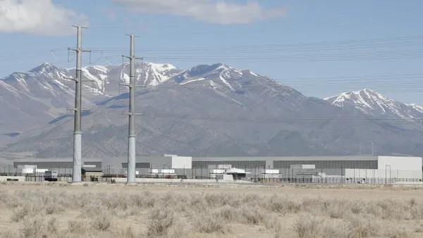 A large building next to power lines.