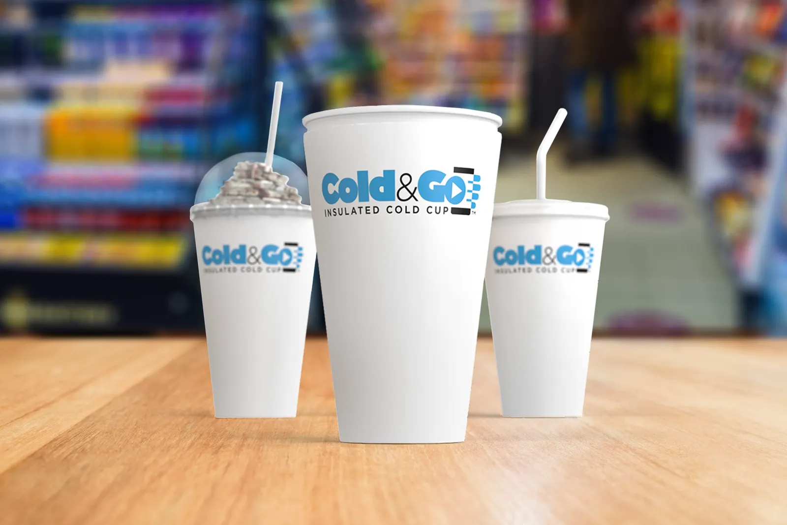Three white paper cups with blue lettering that says Cold&amp;Go.